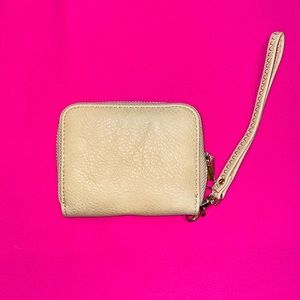 Small wristlet wallet. Matte tan/khaki color.